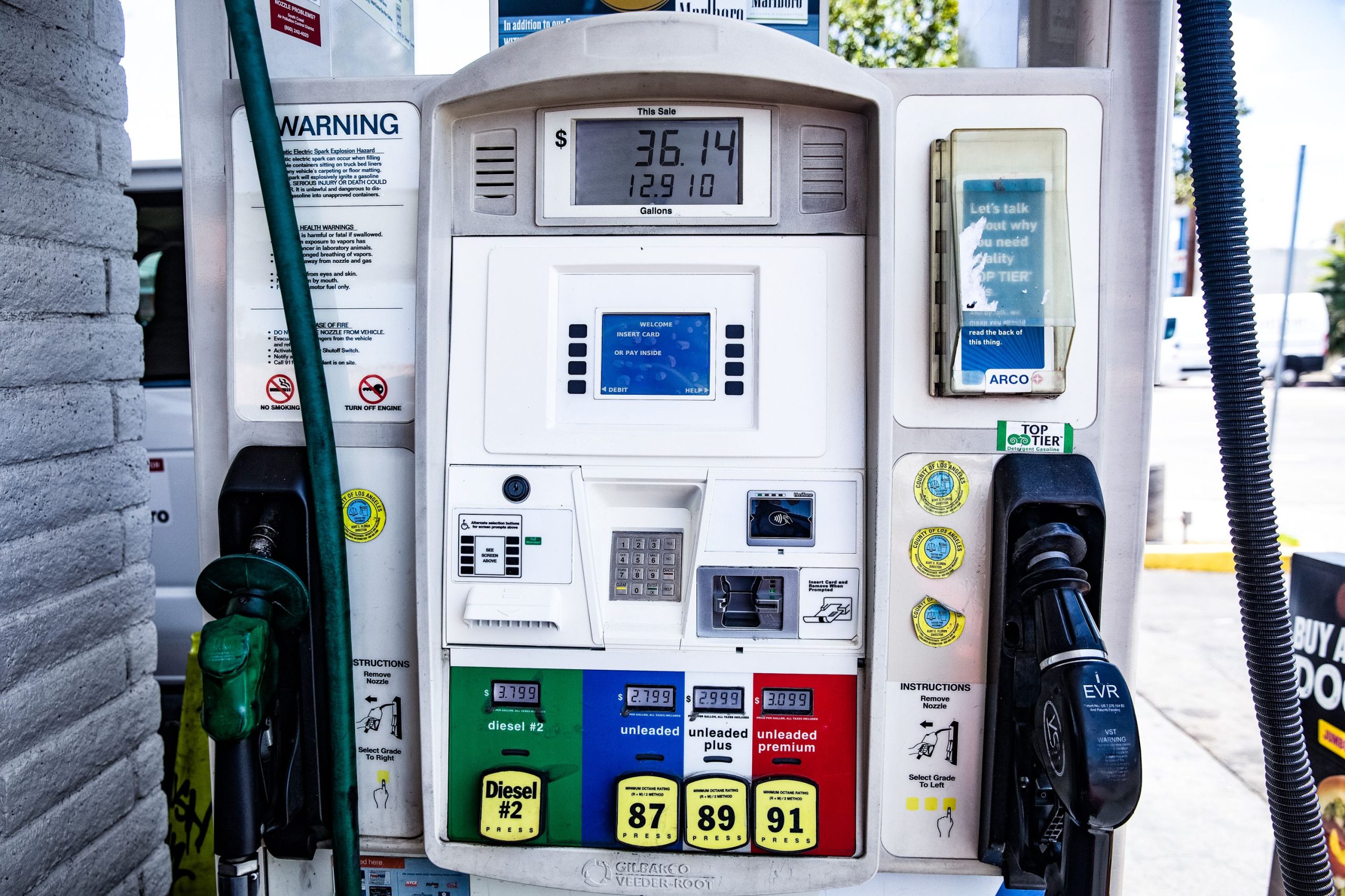 Close-up of a fuel pump showing gasoline and diesel options at a gas station, illustrating rising fuel prices.